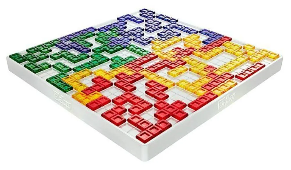 A Blokus board mid-game, with blue, yellow, red and green pieces spreading from the corners