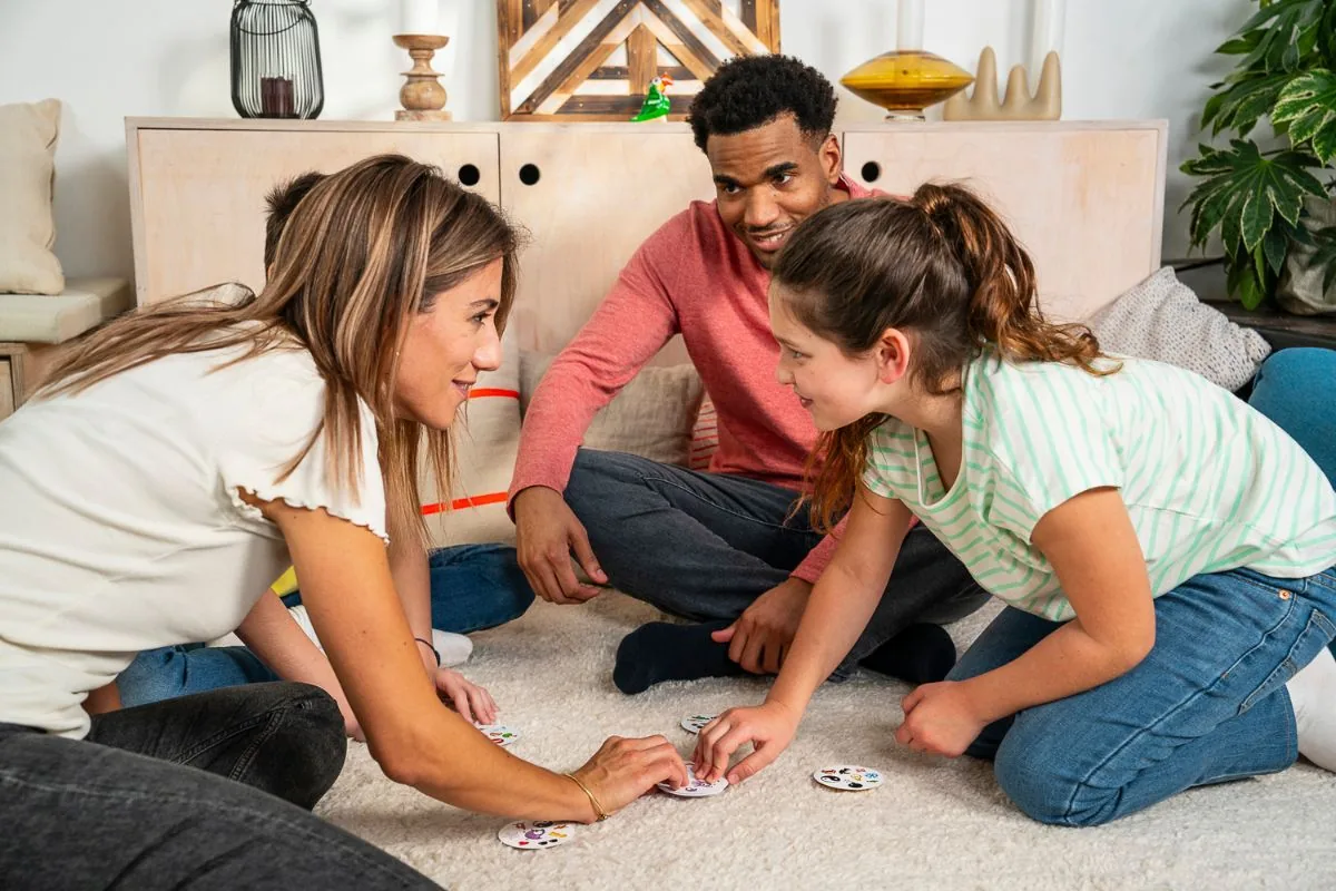 A family playing Dobble on the living-room floor