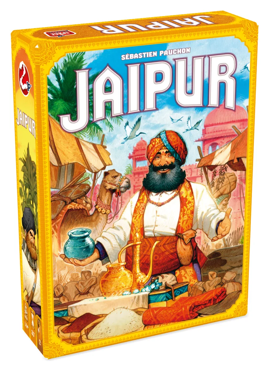 The Jaipur box: a bearded merchant in an orange turban at a market stall, with camels and a pink palace behind