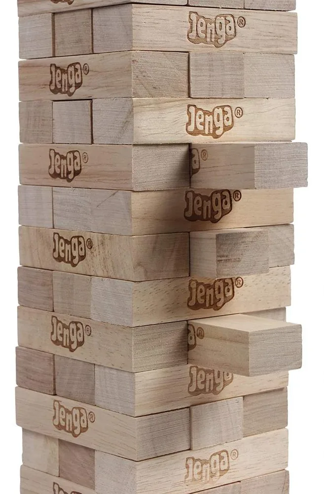 A close view of Jenga blocks sticking out of the tower