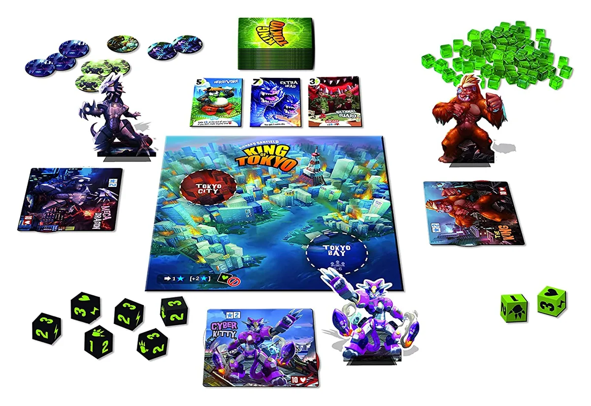 King of Tokyo's board, monster boards and figures, dice, energy cubes and power cards laid out