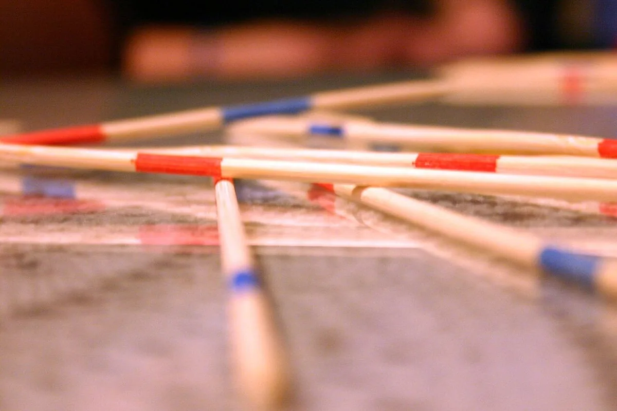 Close-up of crossed Mikado sticks with red and blue bands