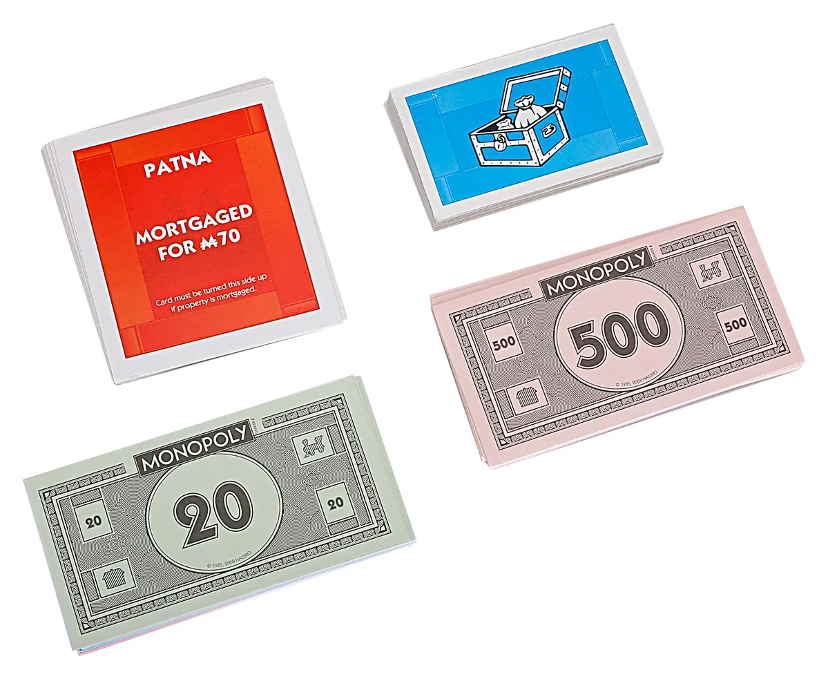Chance and Community Chest cards with Monopoly banknotes