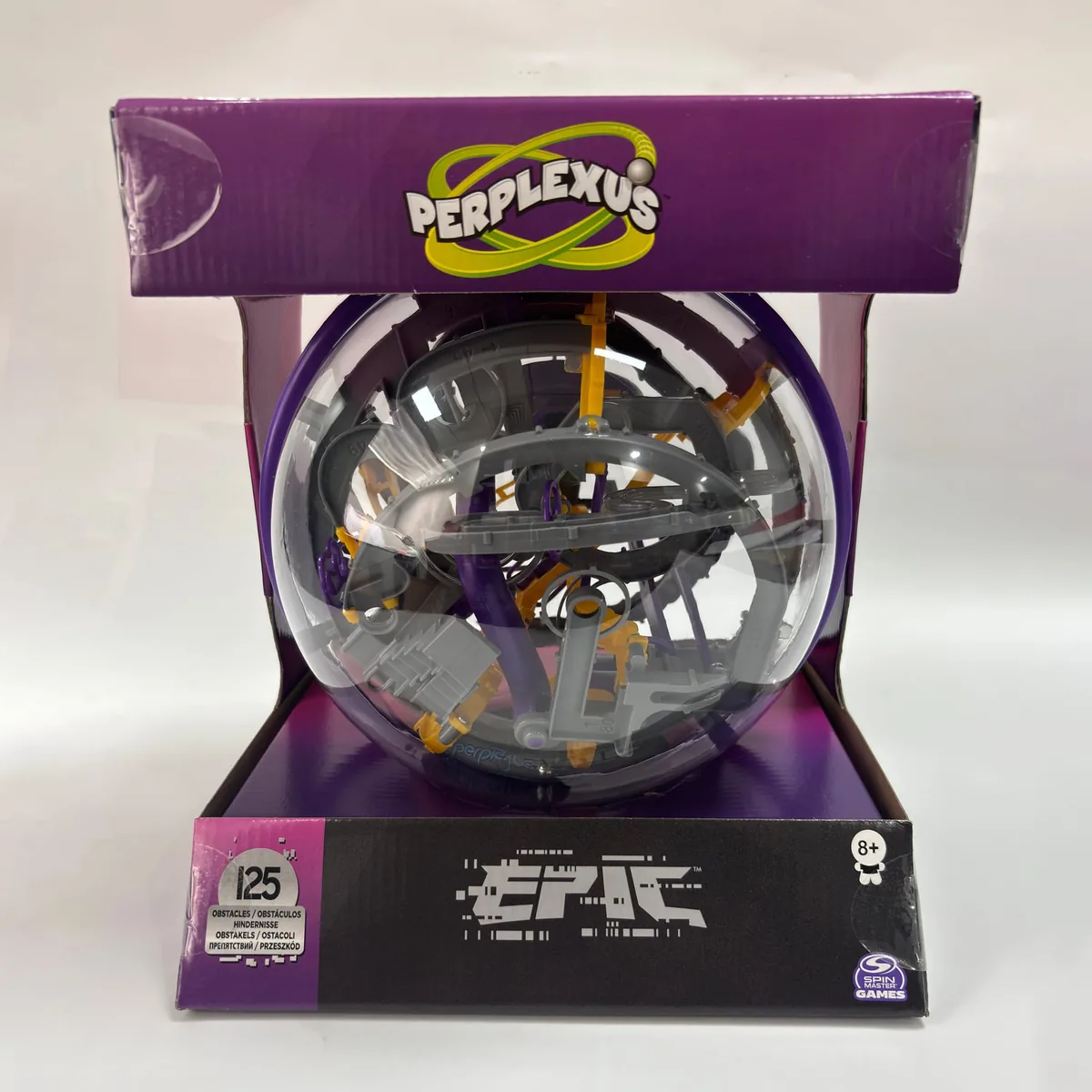 The newest Perplexus Epic box, with a yellow-and-green Perplexus logo on the purple top