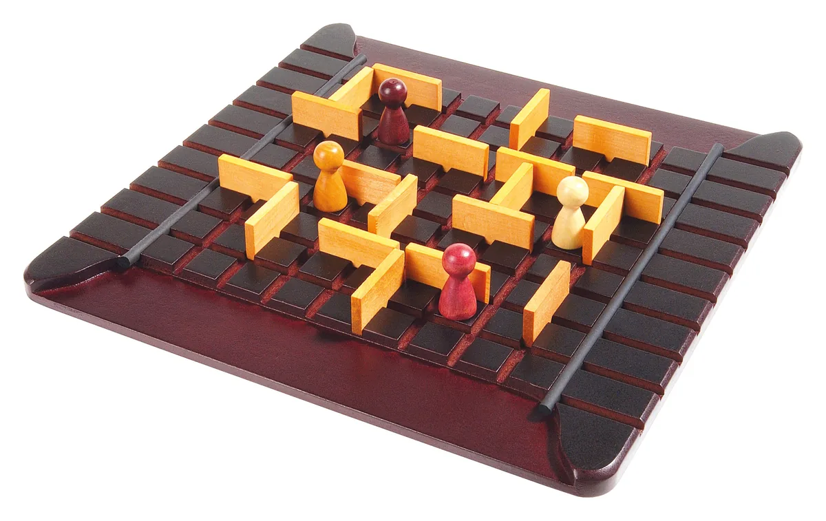 A dark wooden Quoridor board mid-game, with pawns finding their way between light wooden walls
