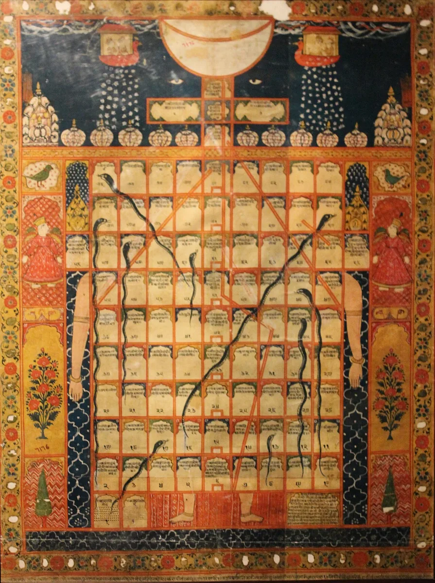 A painted Gyan Chaupar board with rows of squares, snakes and ladders