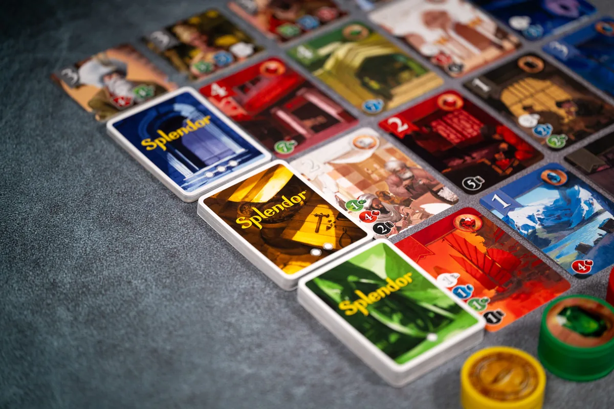 Close-up of development cards collected in front of a player, showing the gems they produce