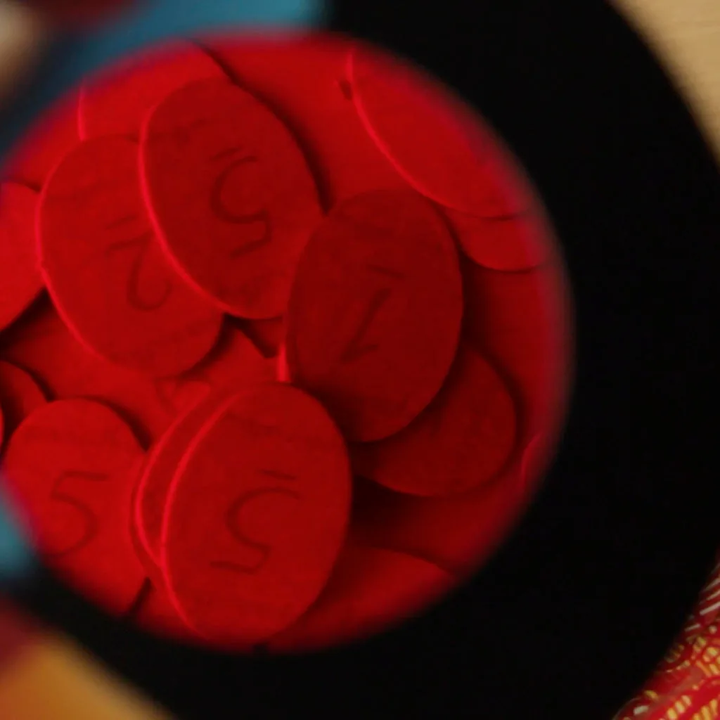 Red fingerprint tokens seen through a red decoder lens