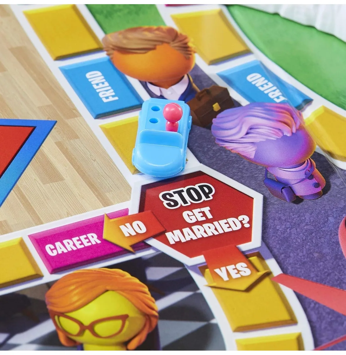 Cars with peg people at the 'Stop: get married?' space on the board